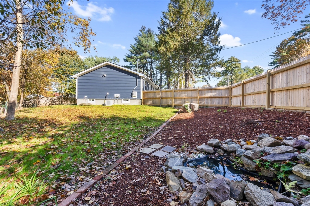 106 Hull Street Beverly, MA 01915 - Photo 30 of 34 a view of a house with a yard