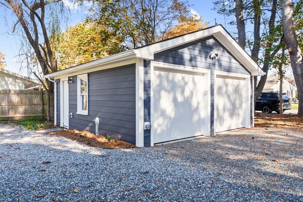 106 Hull Street Beverly, MA 01915 - Photo 31 of 34 a view of a small house with a yard