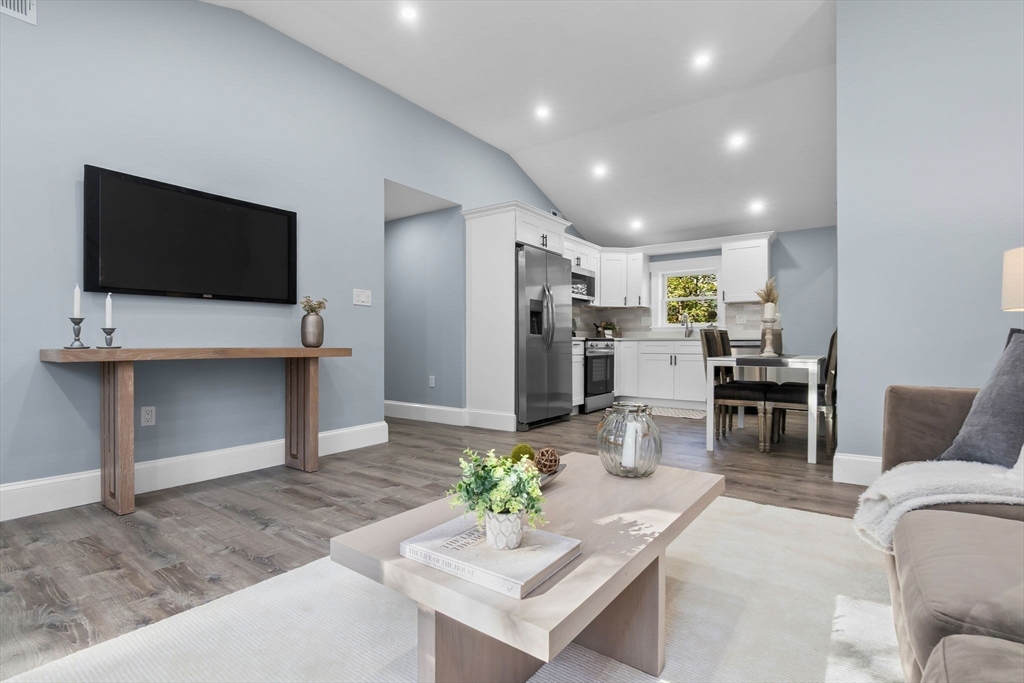 106 Hull Street Beverly, MA 01915 - Photo 7 of 34 a living room with furniture and a flat screen tv