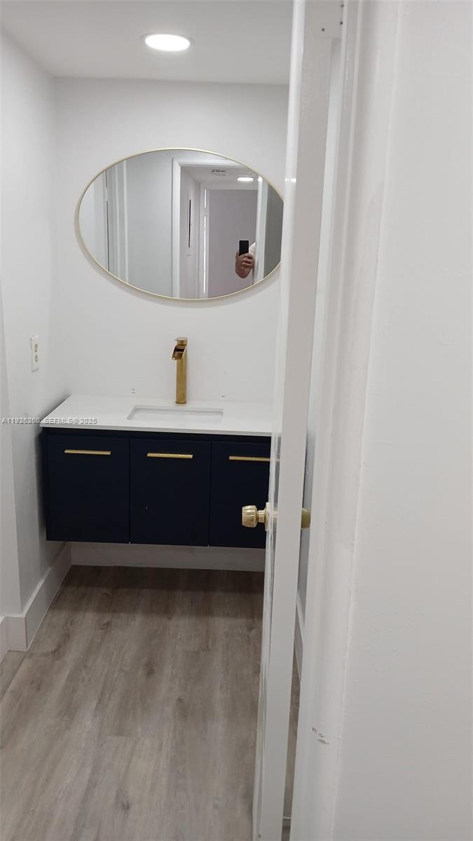 9682 Fontainebleau Boulevard, Unit 312 Miami, FL 33172 - Photo 13 of 33 a room with cabinet and mirror