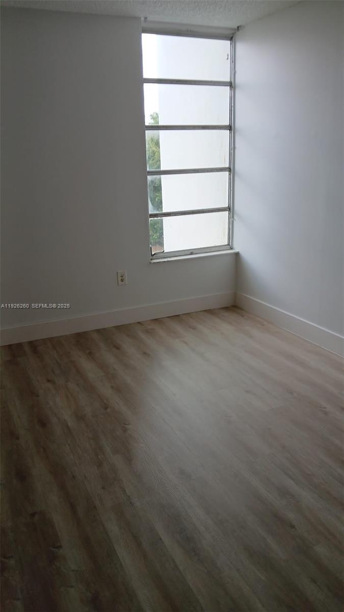 9682 Fontainebleau Boulevard, Unit 312 Miami, FL 33172 - Photo 17 of 33 an empty room with a window