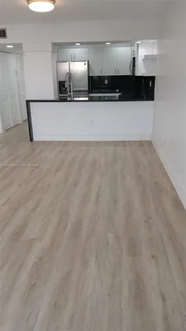 a view of a kitchen with a sink