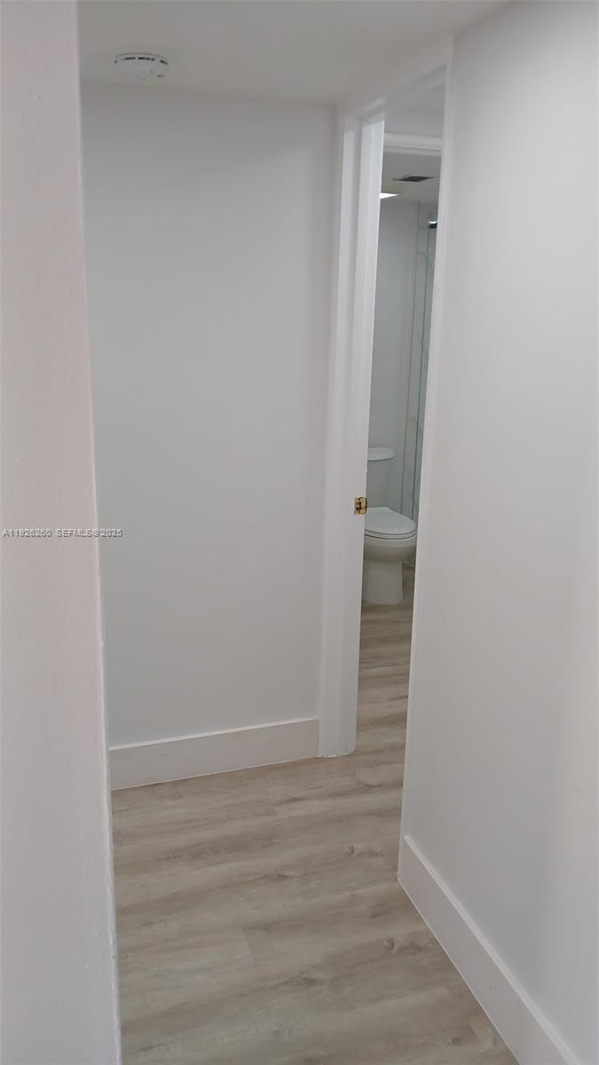 9682 Fontainebleau Boulevard, Unit 312 Miami, FL 33172 - Photo 23 of 33 a view of an empty room