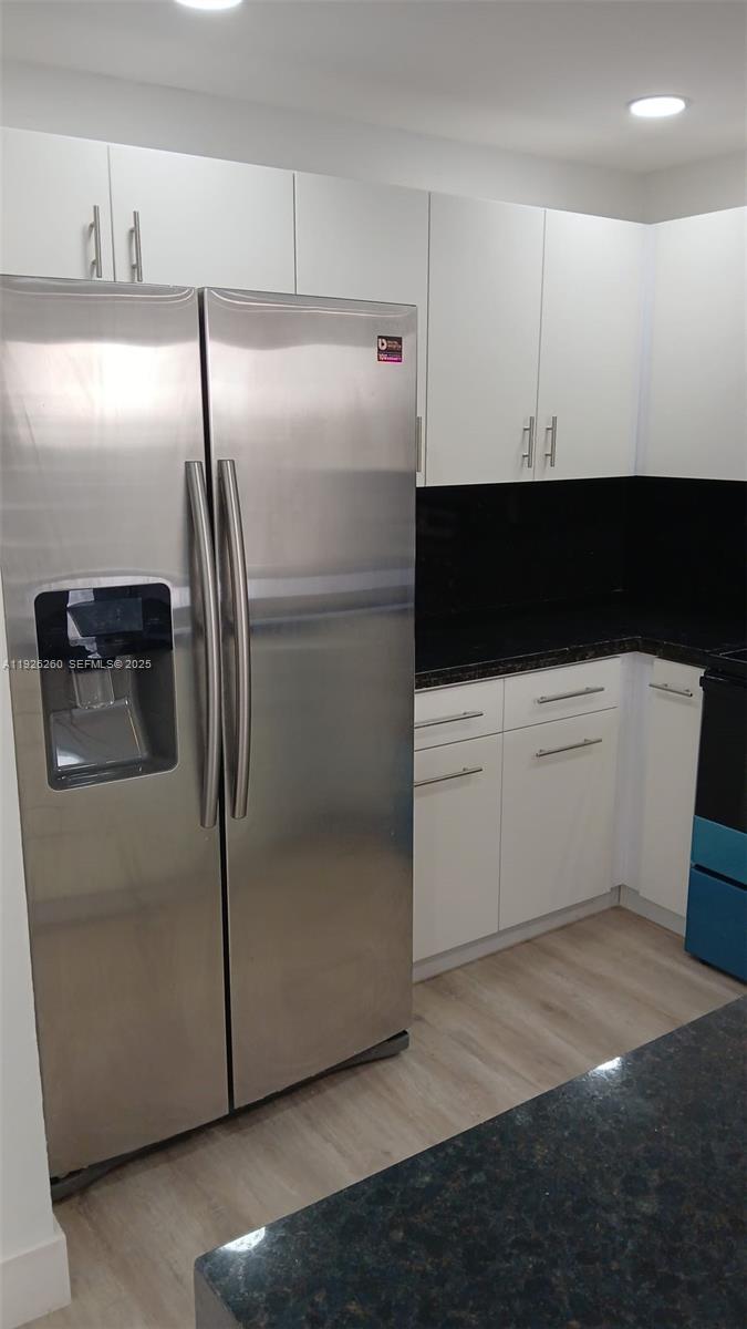 9682 Fontainebleau Boulevard, Unit 312 Miami, FL 33172 - Photo 28 of 33 a kitchen with a refrigerator and a sink