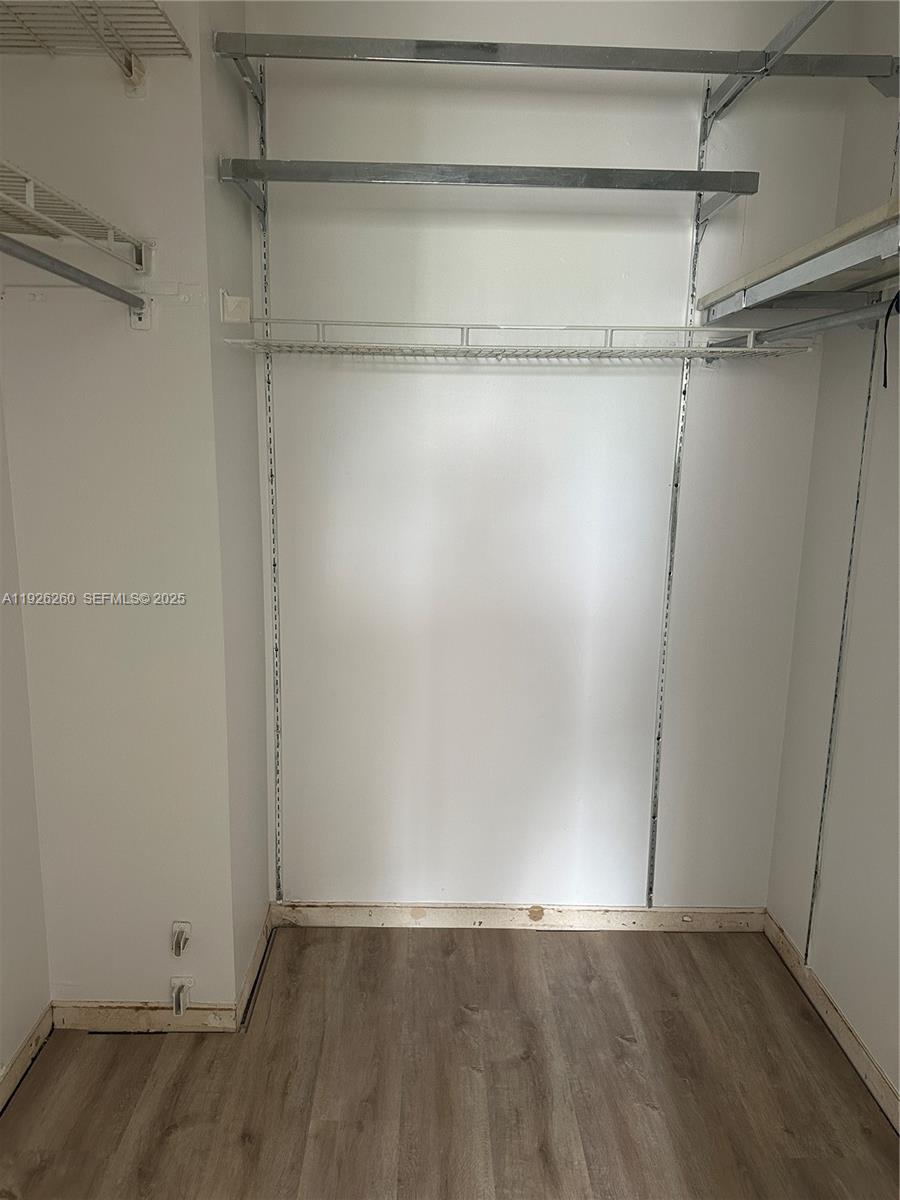9682 Fontainebleau Boulevard, Unit 312 Miami, FL 33172 - Photo 33 of 33 a view of an empty walk in closet