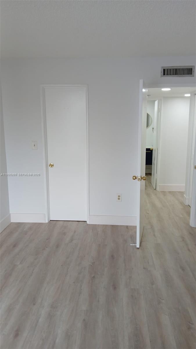 9682 Fontainebleau Boulevard, Unit 312 Miami, FL 33172 - Photo 6 of 33 a view of an empty room
