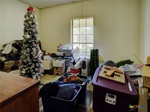 a room with furniture workspace and a window