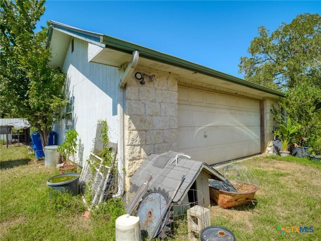 a backyard of a house with seating space