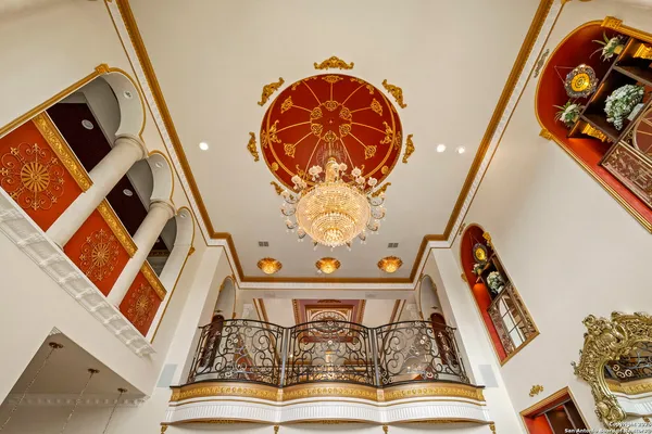 a aerial view of a house with yard and green space