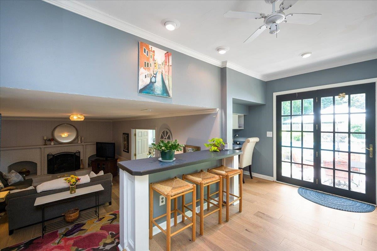 7709 Fiesta Way Raleigh, NC 27615 - Photo 9 of 25 Built in bar overlooking family room, and next to a built in desk