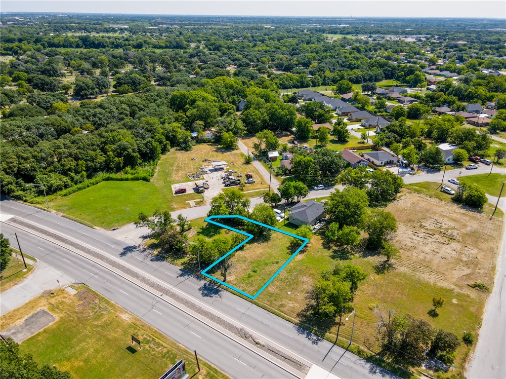 905 North Texas Avenue Bryan, TX 77803 - Photo 3 of 10 an aerial view of a houses with a yard