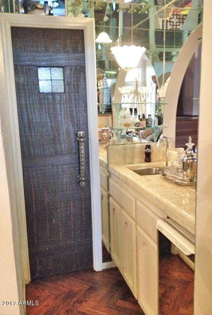 4432 East Camelback Road, Unit 117 Phoenix, AZ 85018 - Photo 12 of 15 Wet Bar between Living Rm & Dining Rm