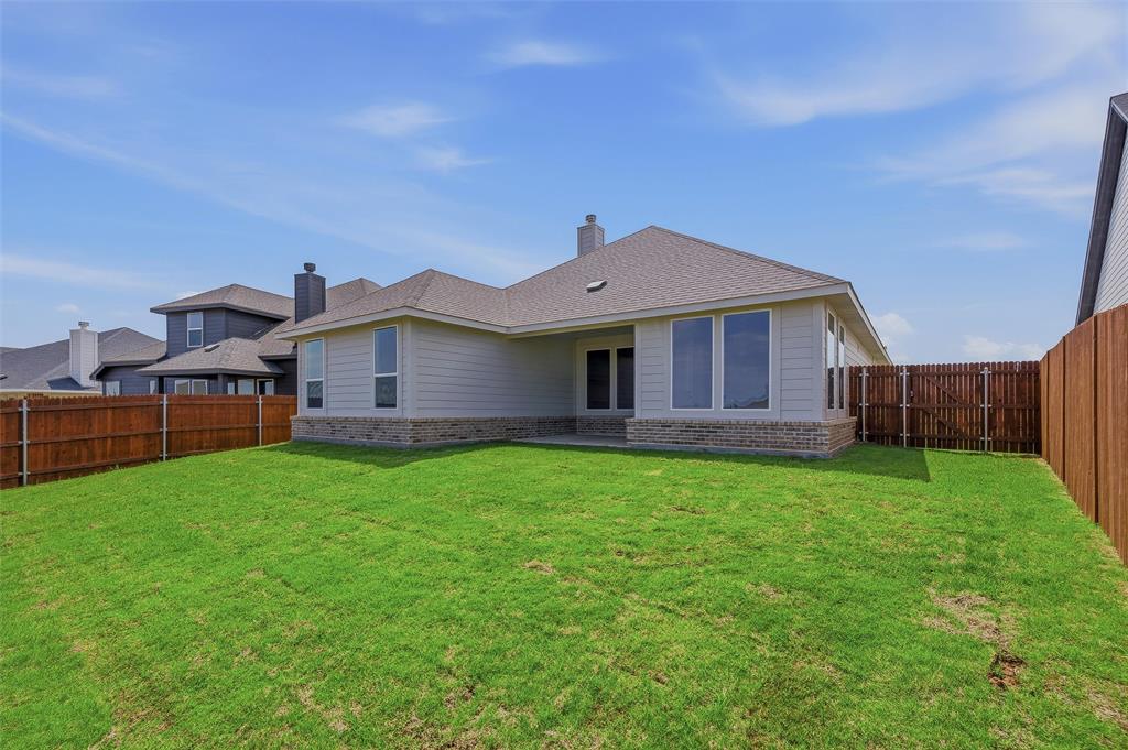 1201 Colca Drive Springtown, TX 76082 - Photo 30 of 32 Expansive green lawn with a full wooden fence