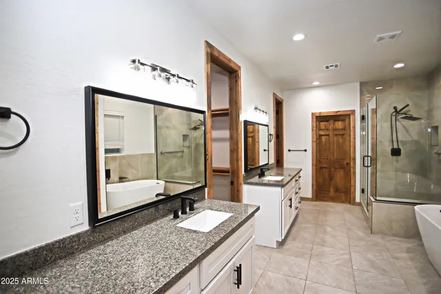 a living room with furniture and a ceiling fan