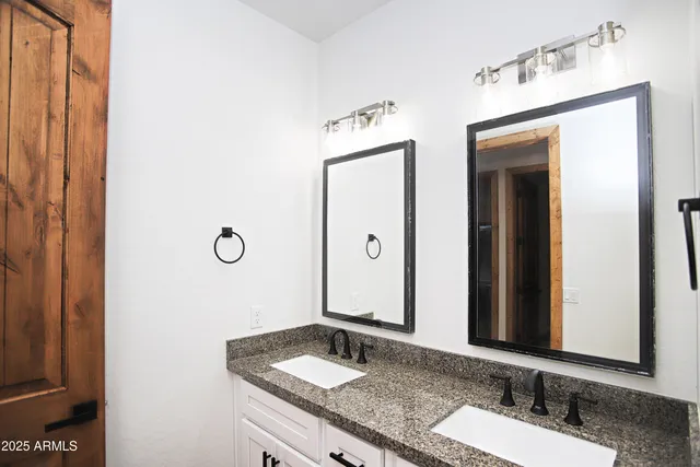 a room with a bed and a chandelier