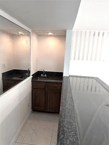 a kitchen with a sink and a stove