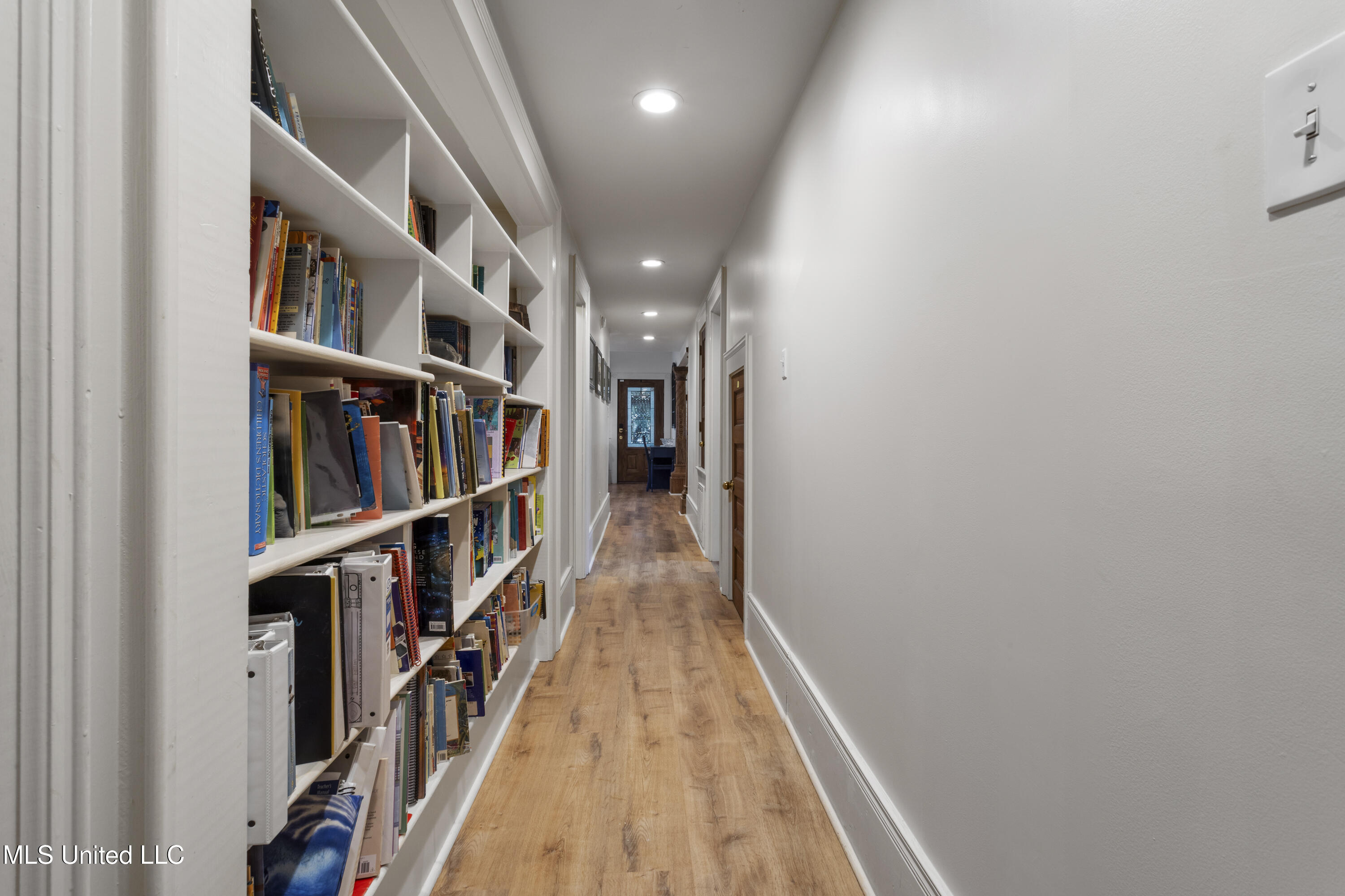 2 Nelson Lane Pass Christian, MS 39571 - Photo 43 of 85 Bookshelves first floor hallway