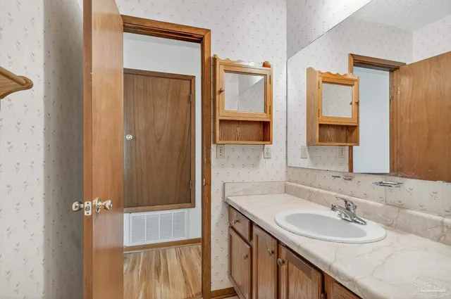 a bathroom with 2 sink and a mirror