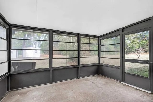 a view of empty room with windows