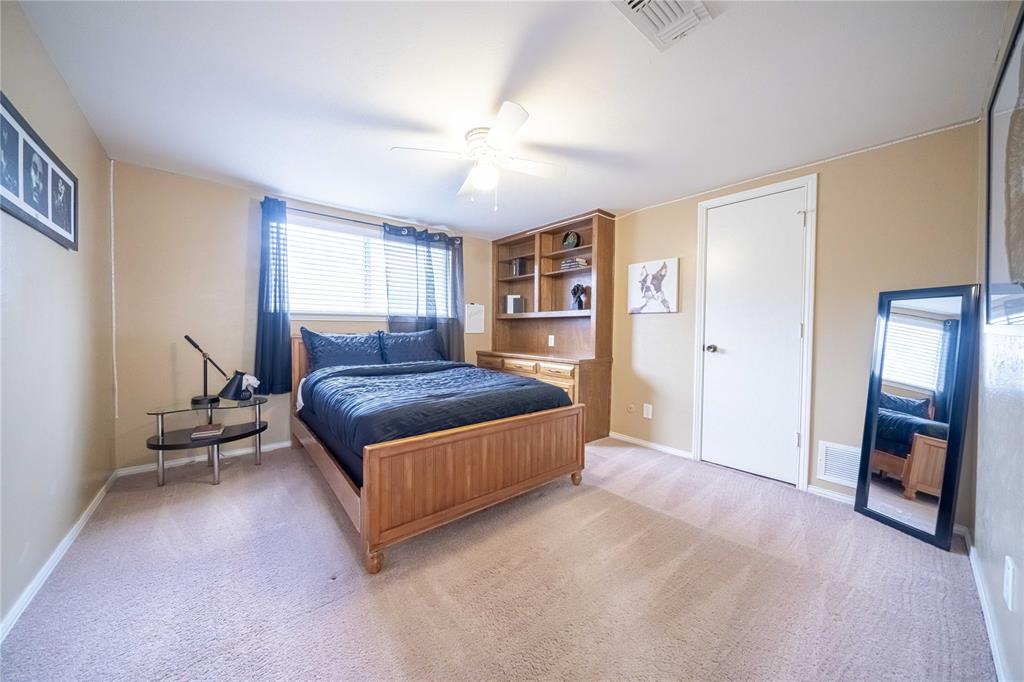 919 Green Hills Road Duncanville, TX 75137 - Photo 28 of 37 Bedroom with light colored carpet, baseboards, and ceiling fan