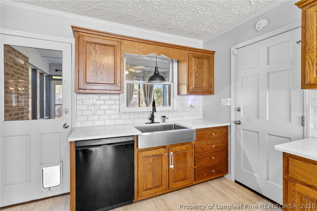 7756 Dragonhead Road Fayetteville, NC 28311 - Photo 13 of 42 a kitchen with stainless steel appliances granite countertop a sink stove and refrigerator