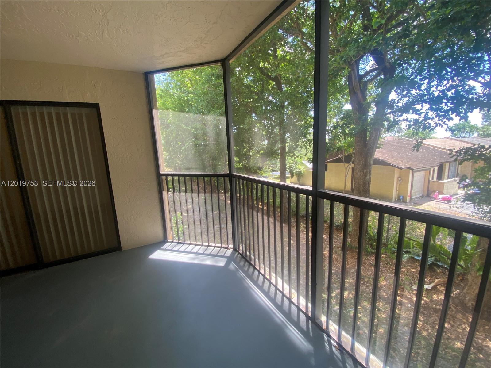 3410 Foxcroft Road, Unit 206 Miramar, FL 33025 - Photo 21 of 23 a view of a balcony with an outdoor space