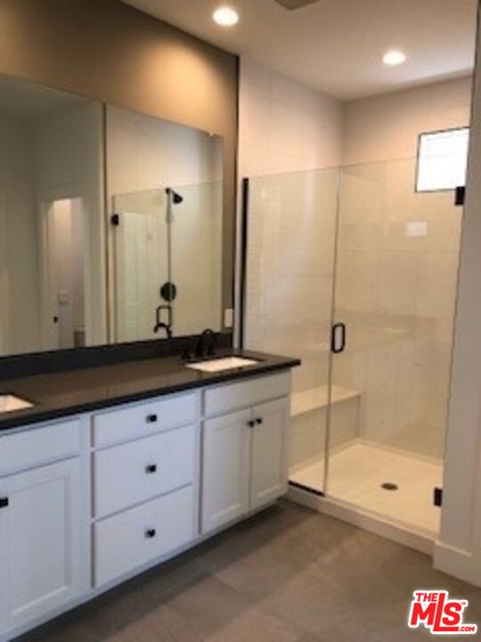 527 Daniel Freeman Circle Inglewood, CA 90301 - Photo 21 of 36 a bathroom with double sink and a shower