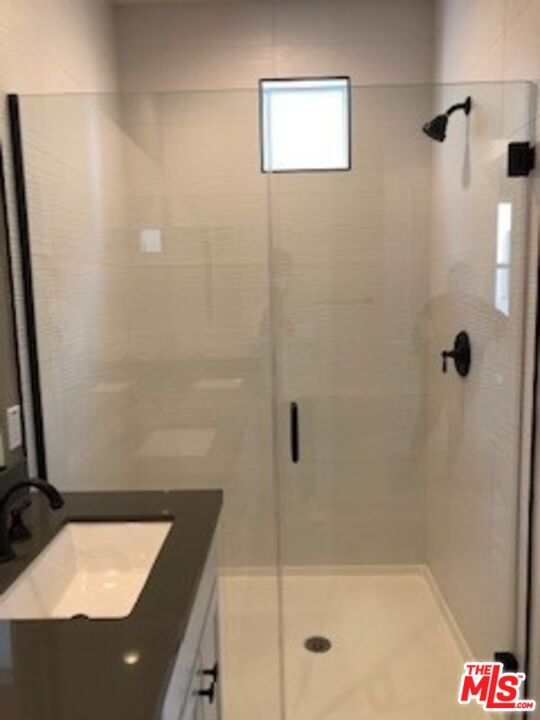 527 Daniel Freeman Circle Inglewood, CA 90301 - Photo 24 of 36 a bathroom with a shower and a sink