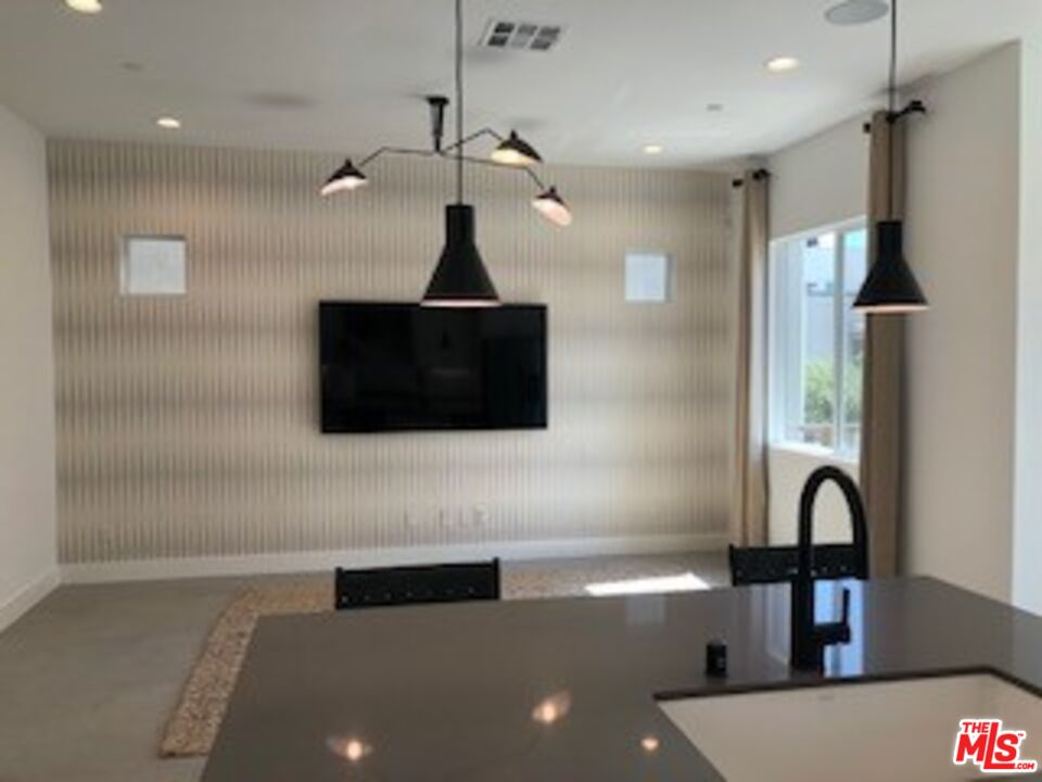 527 Daniel Freeman Circle Inglewood, CA 90301 - Photo 31 of 36 a living room with furniture and a flat screen tv