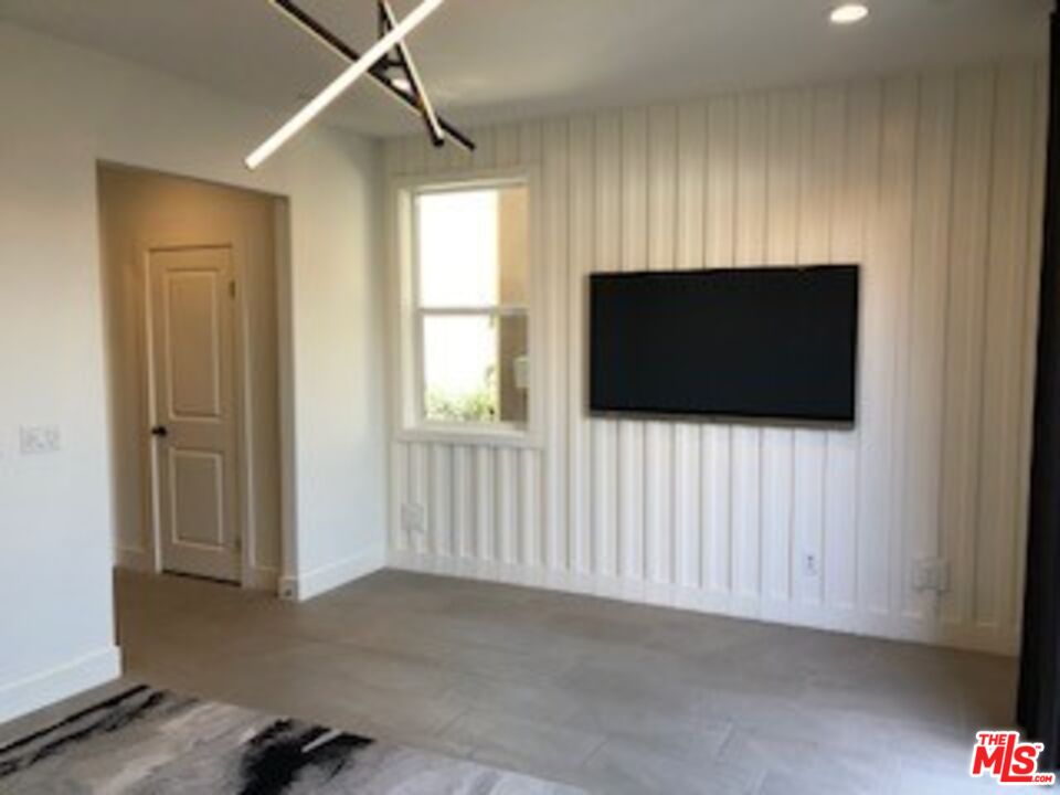 527 Daniel Freeman Circle Inglewood, CA 90301 - Photo 7 of 36 a living room with furniture and a flat screen tv