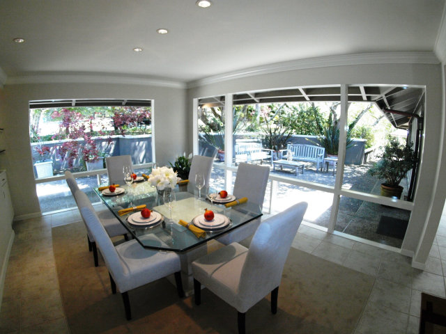 1504 Viscaino Road Pebble Beach, CA 93953 - Photo 11 of 20 a dining room with furniture a large window and a table