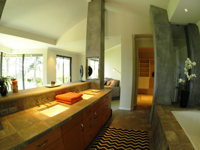 1504 Viscaino Road Pebble Beach, CA 93953 - Photo 19 of 20 a spacious bathroom with a granite countertop sink and a large mirror