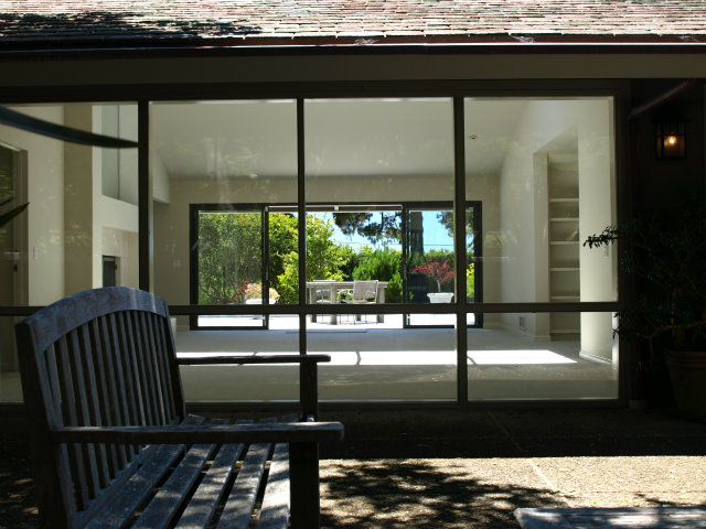 1504 Viscaino Road Pebble Beach, CA 93953 - Photo 8 of 20 a view of a porch with a table and chairs