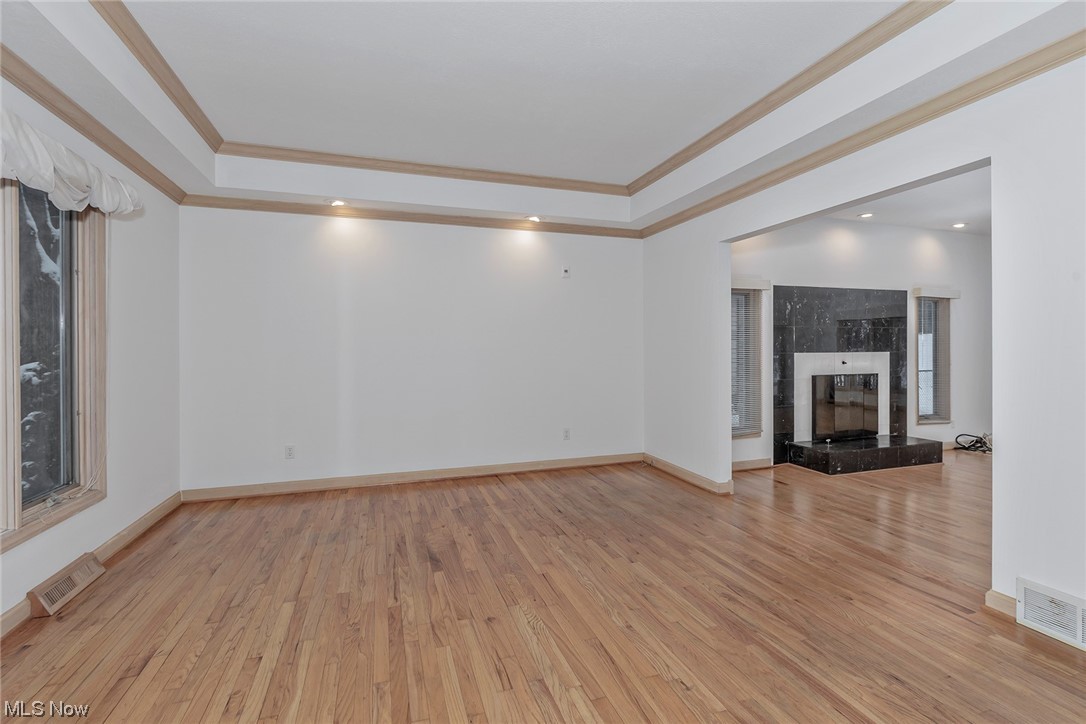 3850 Ellendale Road Moreland Hills, OH 44022 - Photo 3 of 39 Living room featuring a tray ceiling, hardwood flooring.