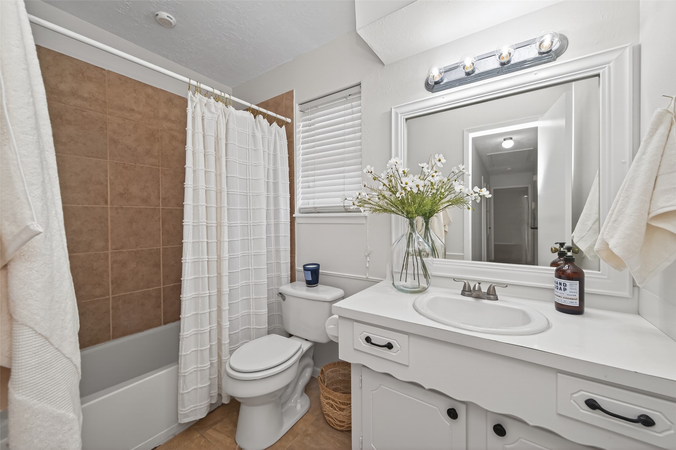 23919 Farm Hill Drive Spring, TX 77373 - Photo 26 of 41 a bathroom with a sink a toilet and shower