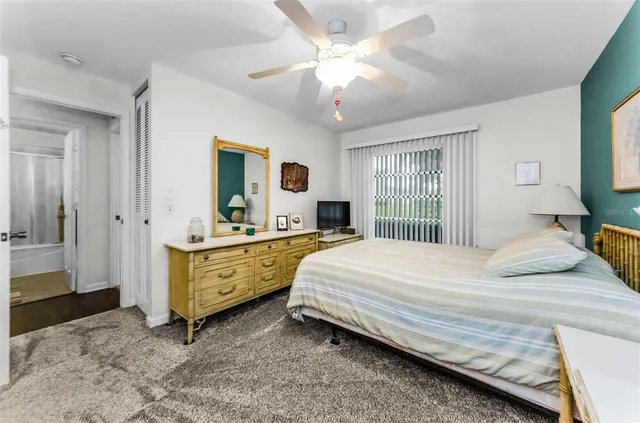 a bedroom with a bed and a dresser