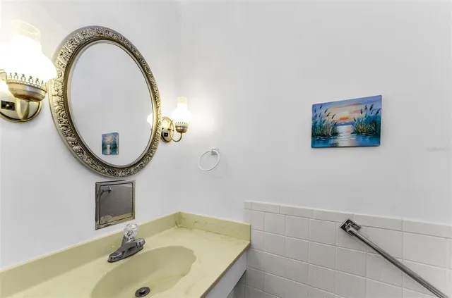 a bathroom with a sink and a mirror