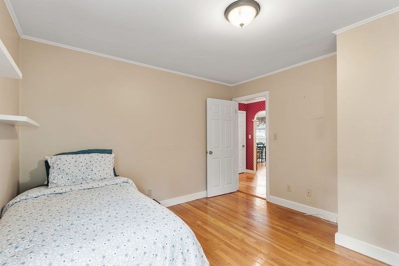 68 Spring Road Nahant, MA 01908 - Photo 11 of 23 a bedroom with bed and wooden floor