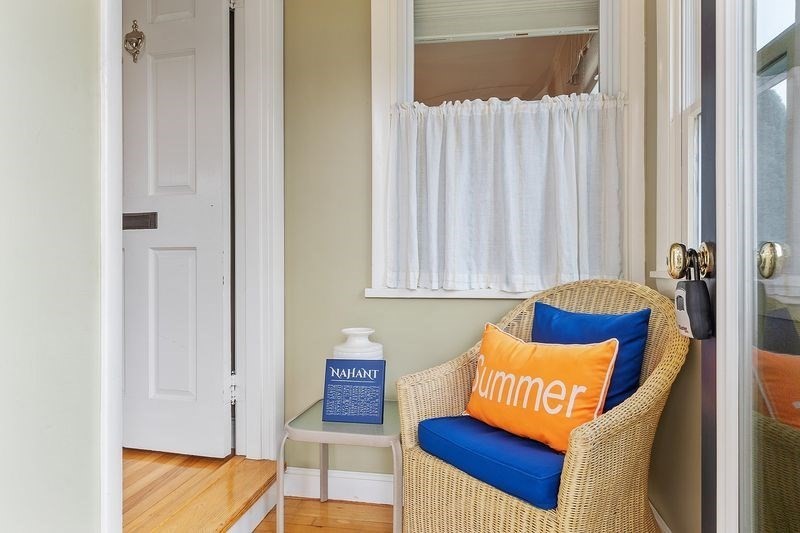 68 Spring Road Nahant, MA 01908 - Photo 3 of 23 a blue bed sitting next to a window