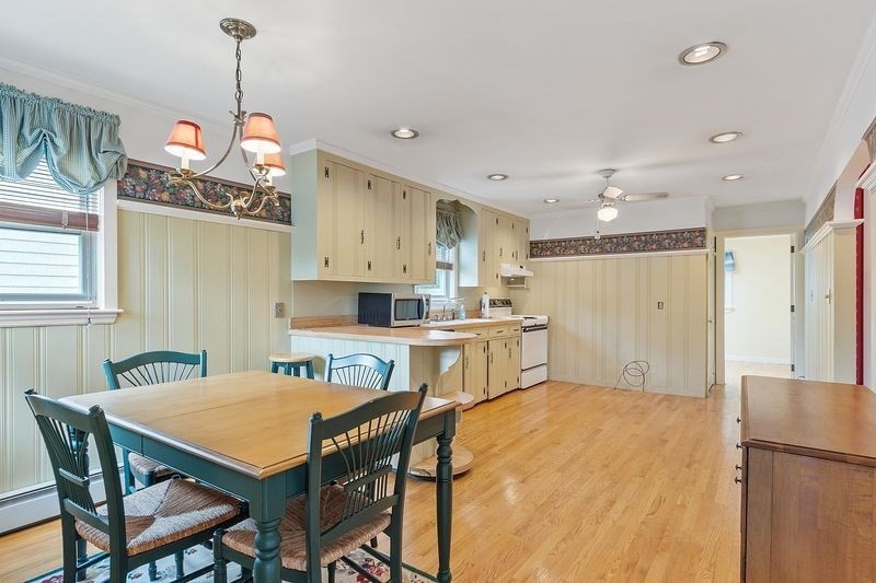 68 Spring Road Nahant, MA 01908 - Photo 8 of 23 a kitchen that has a table and chairs in it