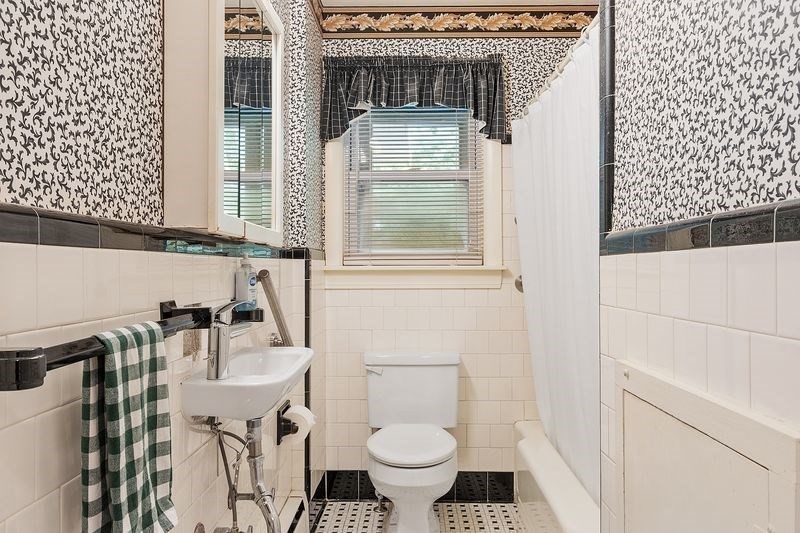 68 Spring Road Nahant, MA 01908 - Photo 10 of 23 a bathroom with a sink toilet and window