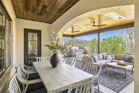 a bedroom with a bed window and chair