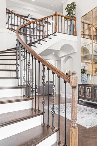 a view of a door with a red door and wooden floor