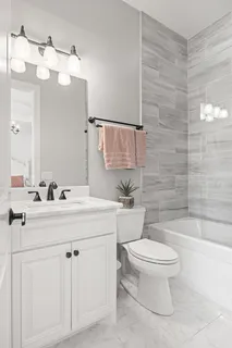 a bed room with a bed and a chair