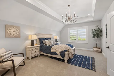 a large kitchen with a table and chairs