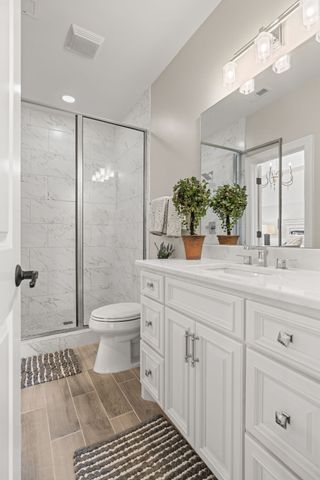 a kitchen with stainless steel appliances a refrigerator and cabinets