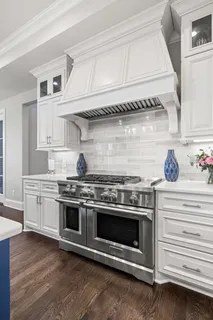 a living room with fireplace furniture and a large window