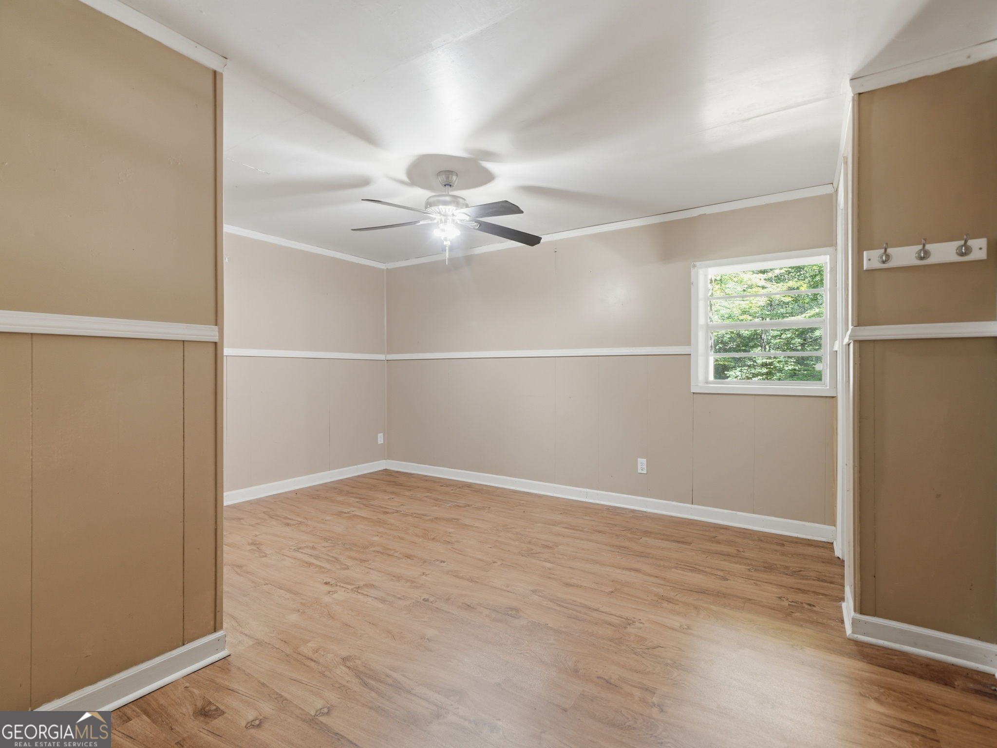 629 Goose Island Road Cherry Log, GA 30522 - Photo 35 of 52 an empty room with windows and fan