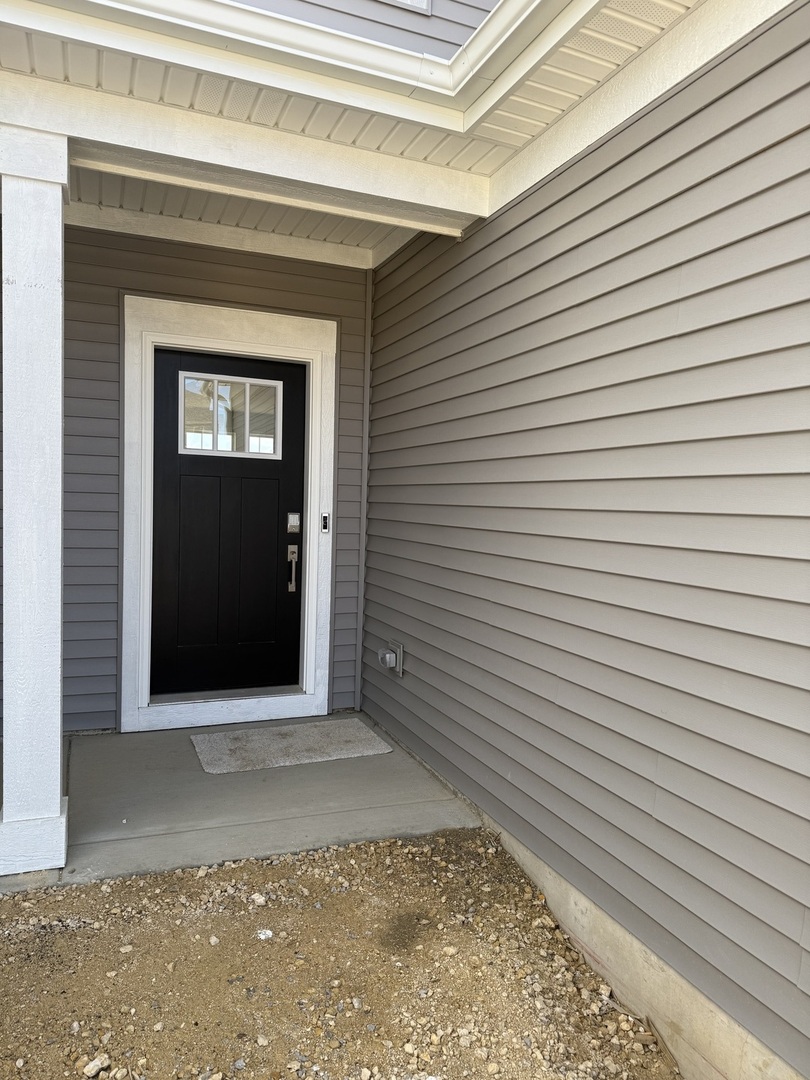 10232 McMahon Way, Unit 10232 Huntley, IL 60142 - Photo 2 of 22 a view of a door of a house