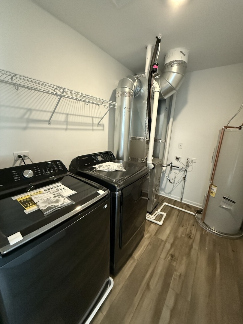 10232 McMahon Way, Unit 10232 Huntley, IL 60142 - Photo 21 of 22 a kitchen with a sink appliances and cabinets
